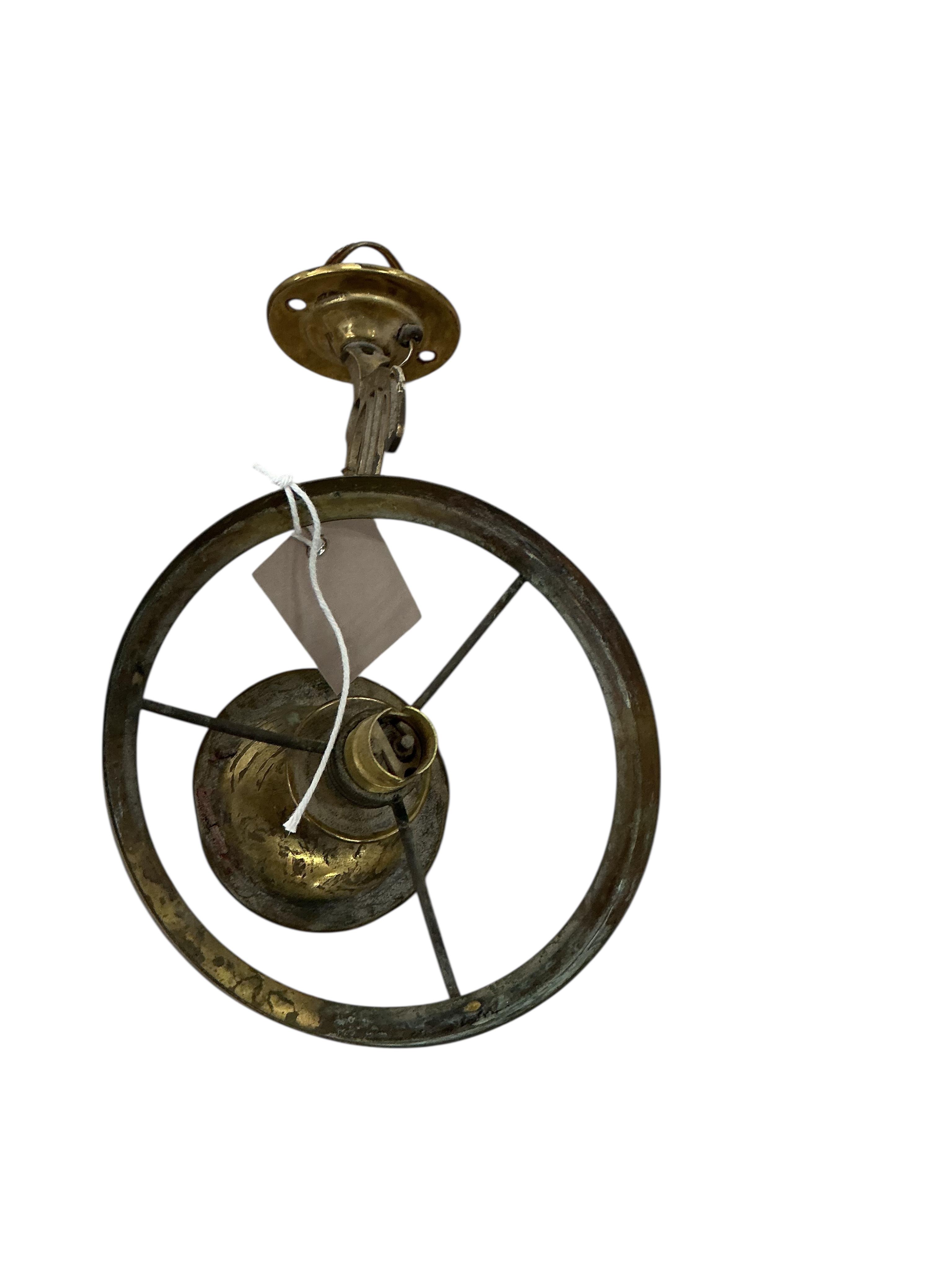 A pair of late Victorian brass wall fitting gas lamps with odd shades (converted), and another electric wall light